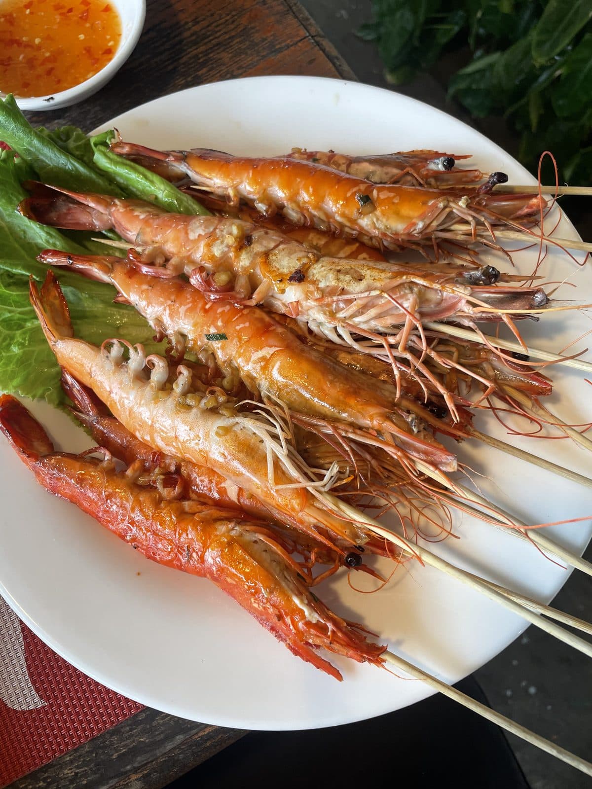 Grilled prawns on skewers, served with dipping sauce, Cambodia